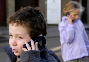 kid using mobile phone